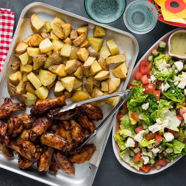 BBQ Glazed Chicken Nibbles with Greek Salad & Garlicky Roasties