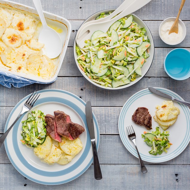 Beef Sirloin Steaks with Cheesy Potatoes and Slaw